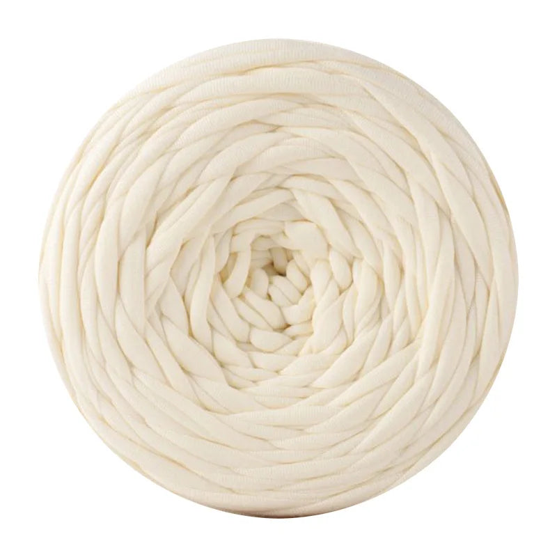 A ball of cream colored soft T-shirt yarn used for crochet