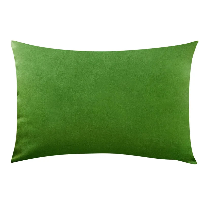 A solid emerald green velvet throw pillow cover.