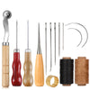 A complete leather craft sewing kit showing various needles, pins, and waxed thread spools.