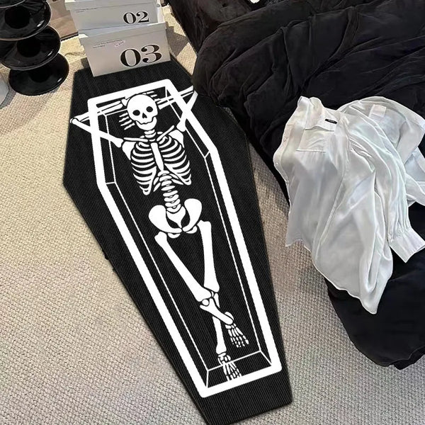 A black floor mat featuring a white graphic of a skeletal figure with a skull design.