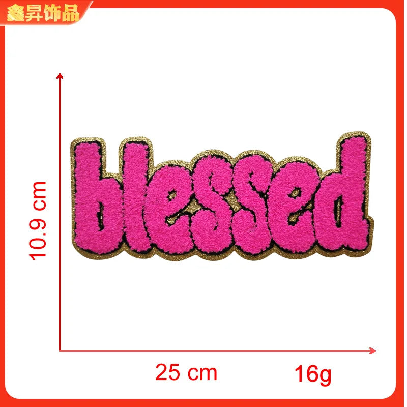 Pink embroidered patch with the word blessed, measuring 10.9 cm long and weighing 16g.