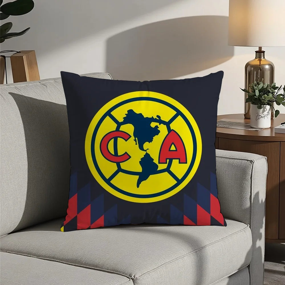 A navy blue decorative pillow featuring a yellow circular logo with the letters CA and a map outline of the United States.