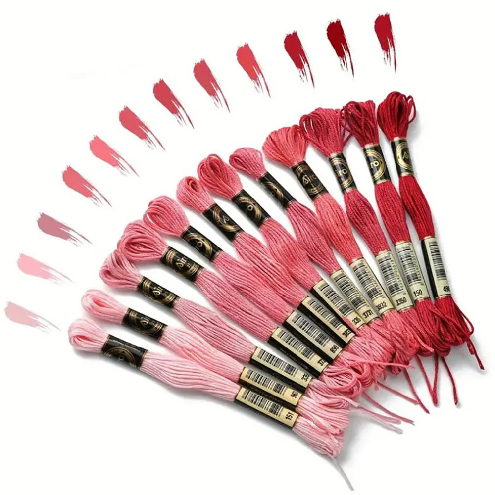A collection of 12 pack rainbow gradient embroidery floss threads arranged in a fan shape.