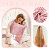A woman is shown using a pink leopard print satin pillowcase for hair and skin care.