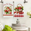 Two white kitchen towels featuring red strawberries and floral designs on a white background