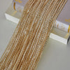 Golden beaded decorative door string curtains displayed next to a book.