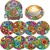 A colorful diamond painting coaster set featuring floral and nature designs, including a round coaster and a latte art cup.