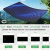 A black conductive grounding mattress pad is shown floating in the air against a blurred green background.