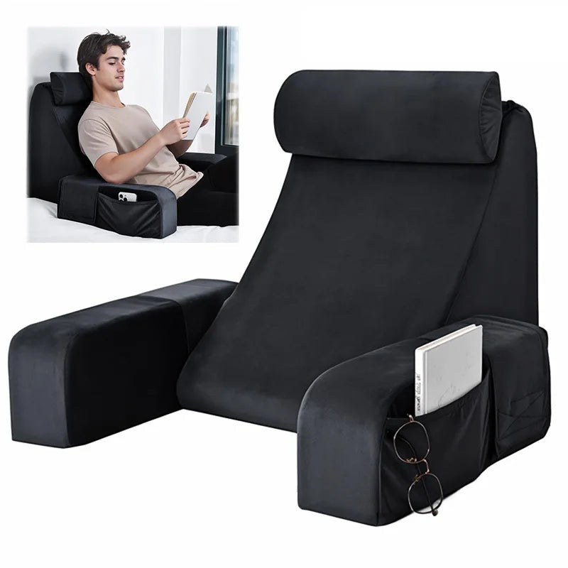 Black ergonomic back support pillow with armrests shown in a seated position.