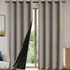 Solid gray blackout window curtains hanging in a doorway with black fabric visible.