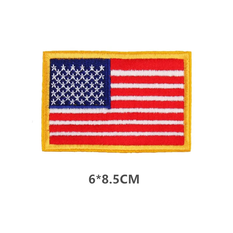 A rectangular embroidered patch featuring the design of the United States flag with red and white stripes and a blue canton o