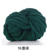 A ball of dark green chunky acrylic yarn used for knitting and crochet projects.