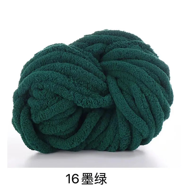 A ball of dark green chunky acrylic yarn used for knitting and crochet projects.