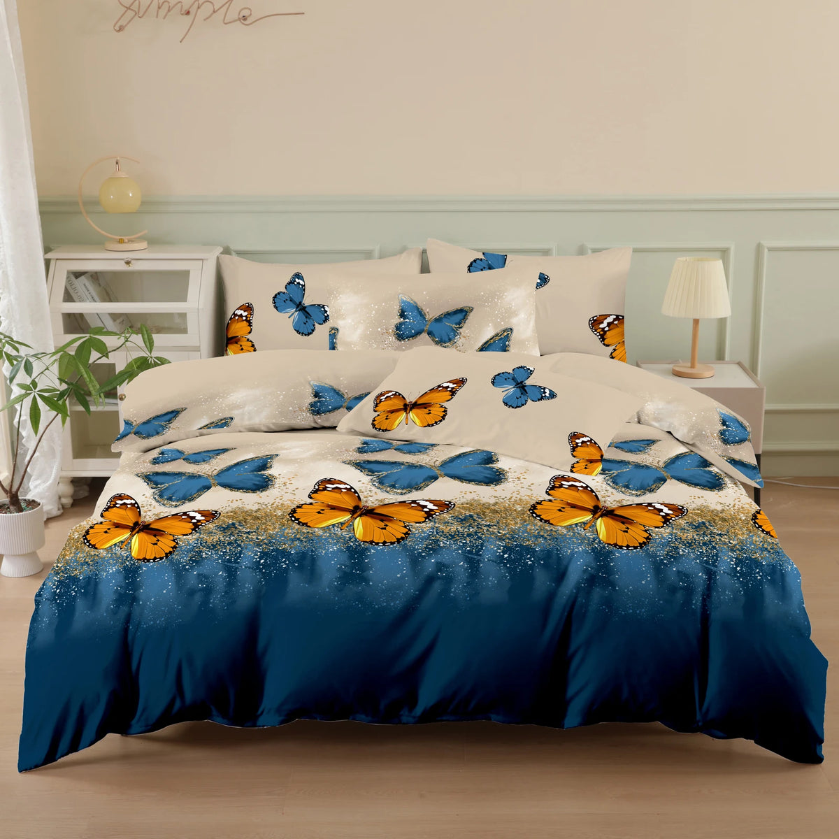A blue and white butterfly print duvet cover set with matching pillowcases displayed on a bed.