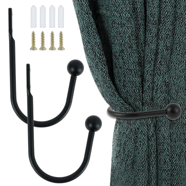 A set of black metal curtain holdback hooks and corresponding screws shown next to a teal curtain.