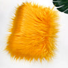 Bright orange faux fur plush fabric used for sewing and crafting