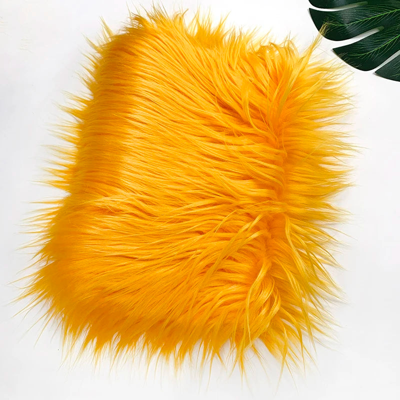 Bright orange faux fur plush fabric used for sewing and crafting