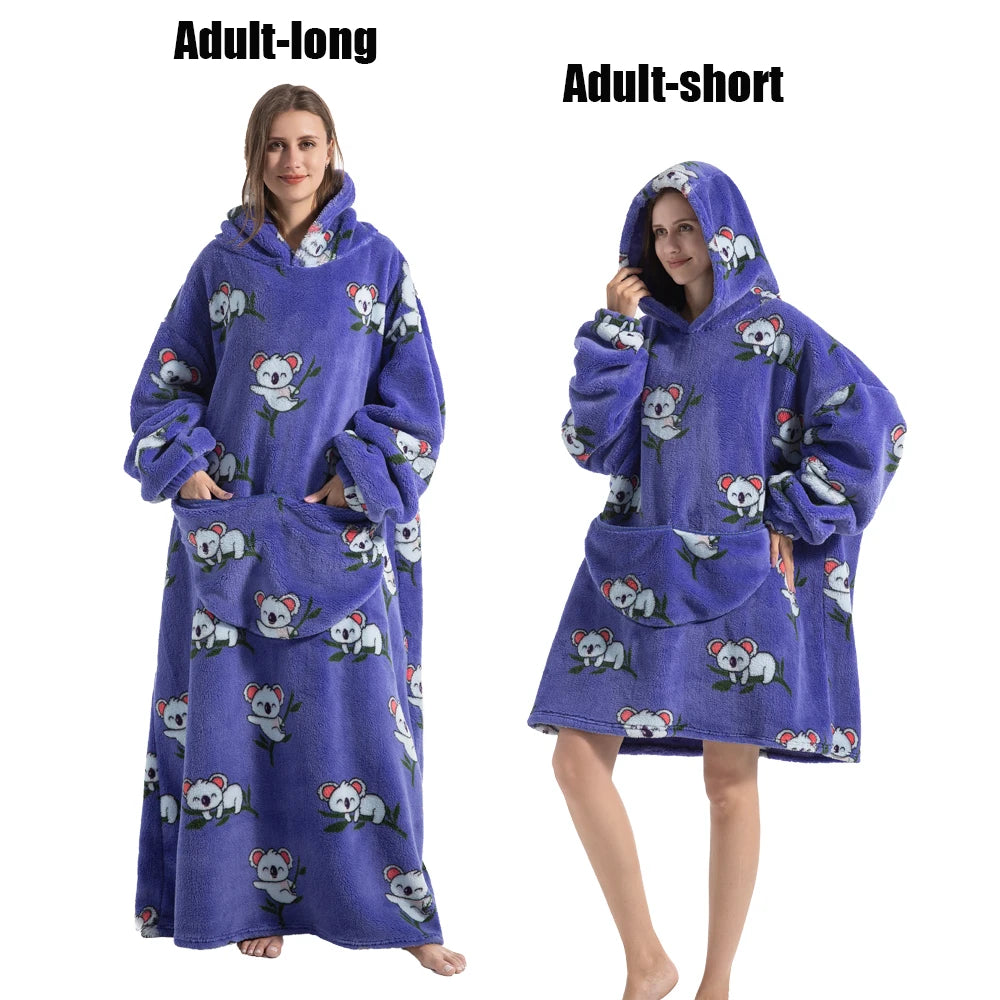 A purple adult-long plush fleece blanket hoodie with a hood and embroidered animals is shown on a model.