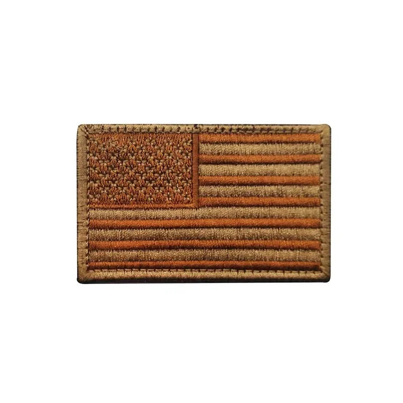 A rectangular patch featuring the design of the USA flag with horizontal stripes and a star field, backed with hook and loop 