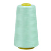 A roll of light mint green sewing thread on a spool.