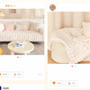 A cream colored plush velvet sofa cover with a textured white throw and pillows displayed in a bright room.