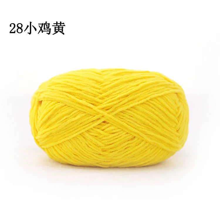 A ball of bright yellow 3mm matte chenille yarn for knitting and crochet.