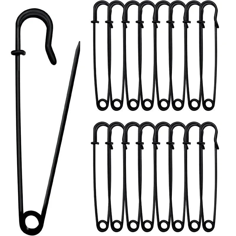 A set of heavy duty stainless steel safety pins in a black package, showing various sizes and styles.