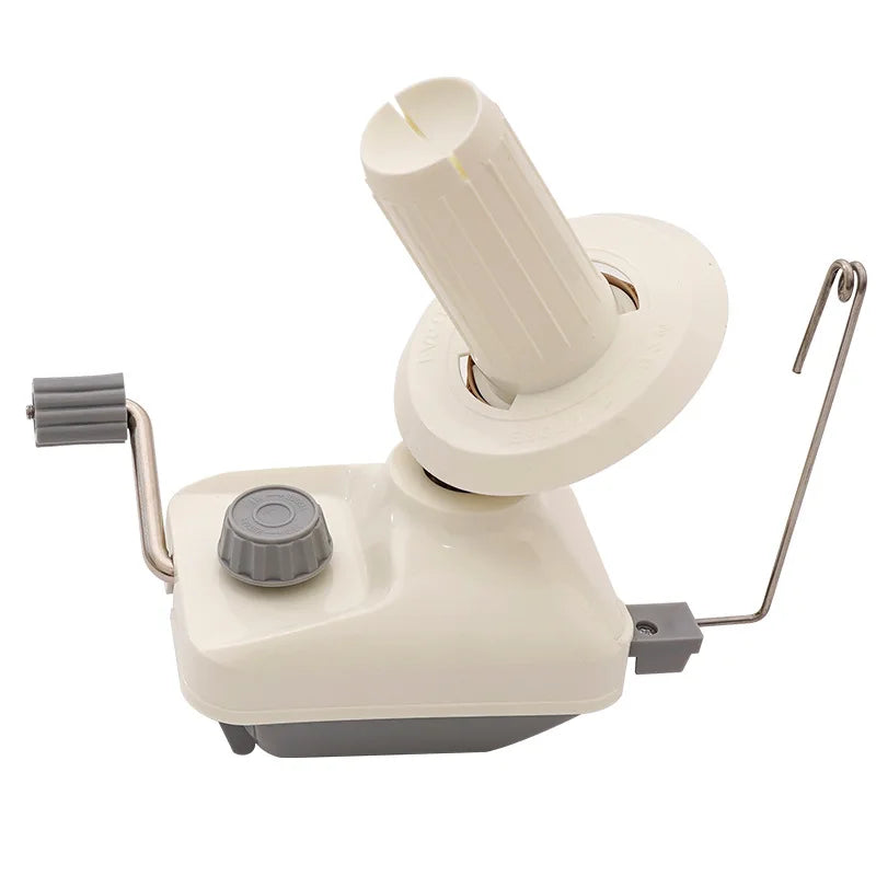 A hand operated wool yarn winder with a white spindle and gray base.