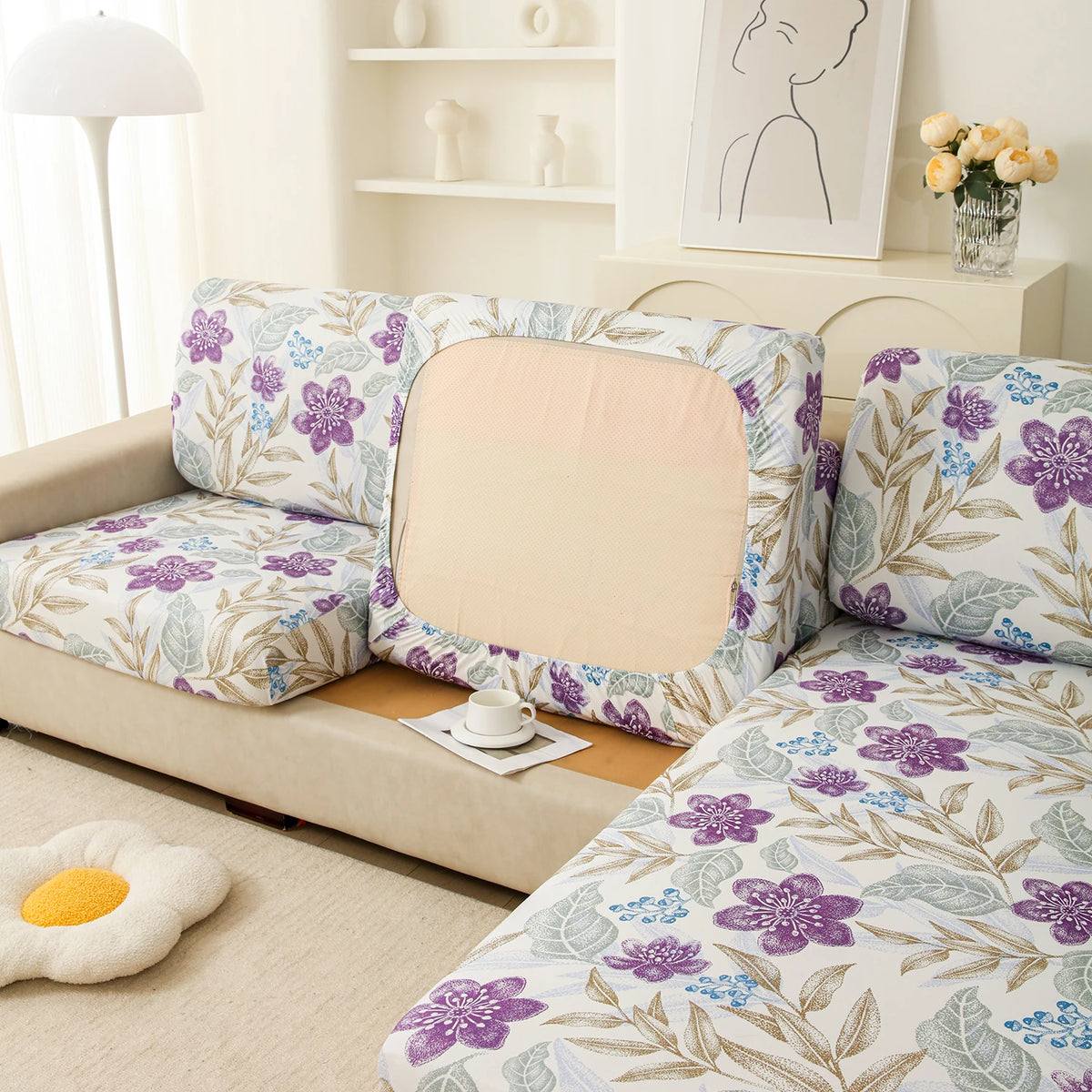 Floral print elastic sofa protective cover featuring purple and green botanical patterns.