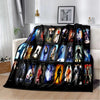 A black flannel throw blanket featuring a collage of retro printed images and figures.