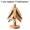 A natural wooden tree support with three leaf coasters.