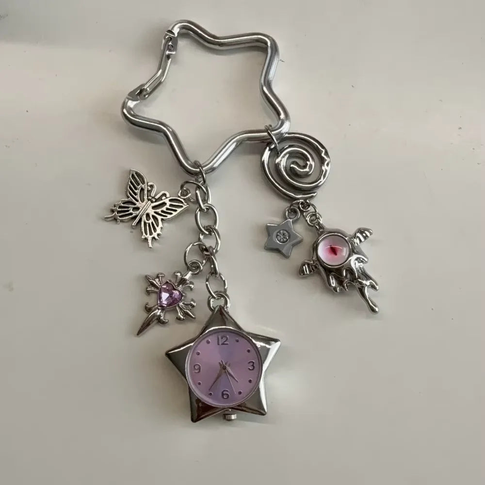 Silver star pocket watch keychain featuring a butterfly charm and a pink gemstone detail.