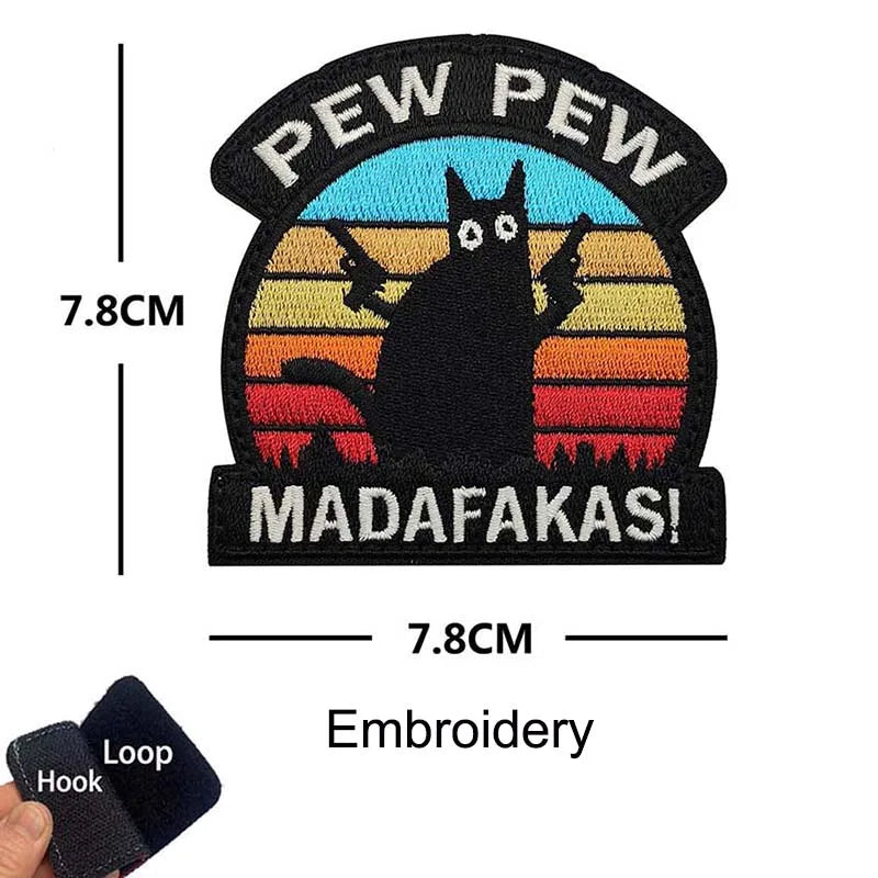 Black embroidered patch featuring a cat silhouette against a sunset background with text reading Pew Pew and MADAFAKAS!
