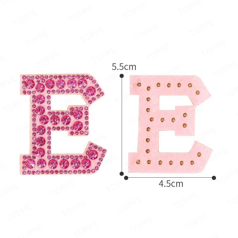 Pink rhinestone letter patches for DIY showing the letters E and E