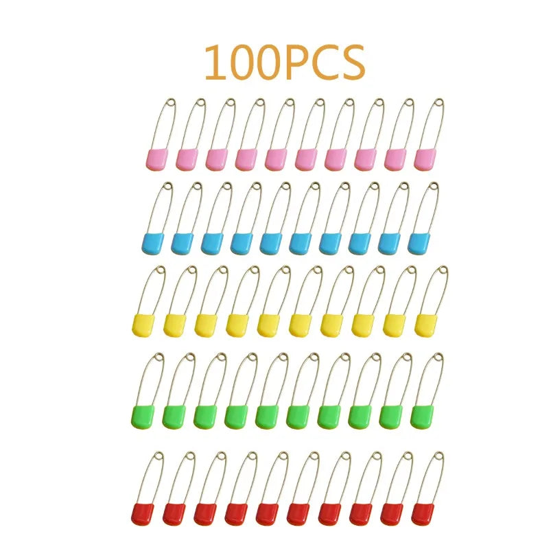 A collection of 100 stainless steel diaper pins in various colors including pink, blue, yellow, and green.
