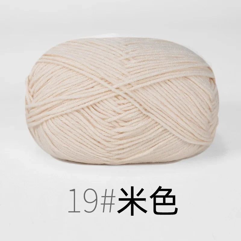 A ball of light beige organic cotton 4ply knitting yarn for crafts.