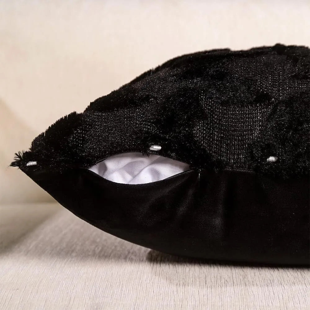 Black velvet throw pillow cover with a textured, fuzzy top and a smooth base.