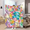 A colorful flannel blanket featuring a floral print with various teddy bears and flowers.