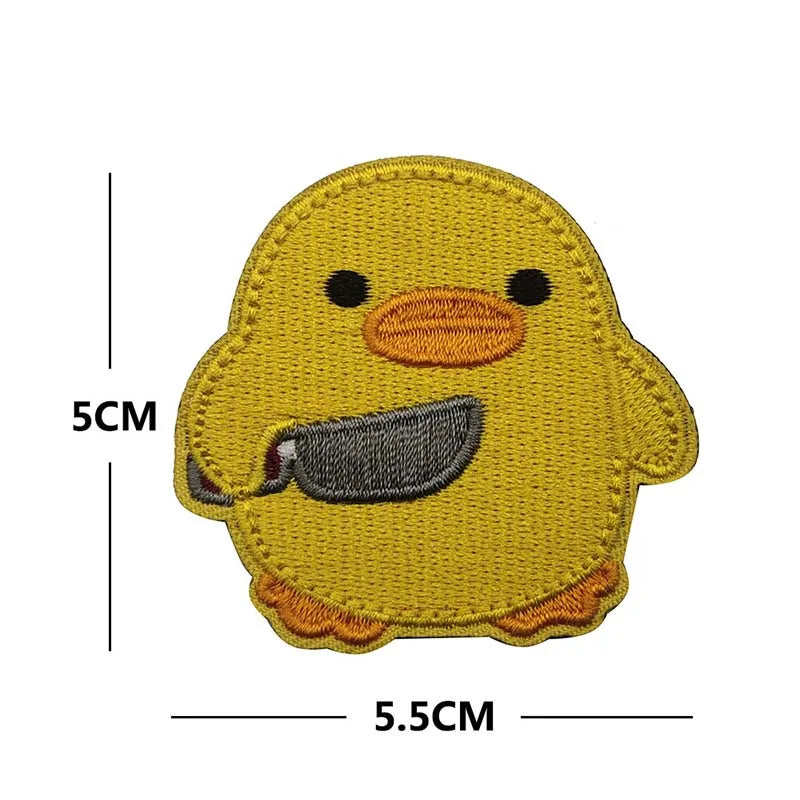 A yellow embroidered patch of a duck with black eyes and a dark beak.