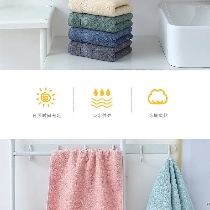 A set of six folded, pastel-colored cotton face towels displayed on a shelf next to a white sink.