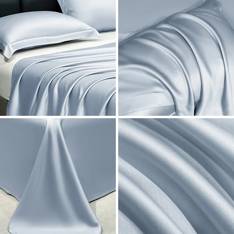 Close-up view of a silky, light blue cooling bed sheet draped in flowing folds.