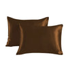 Two smooth brown satin pillowcases lying flat.
