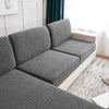 Gray splashproof jacquard sofa cushion covers on a modern sofa in a bright room.
