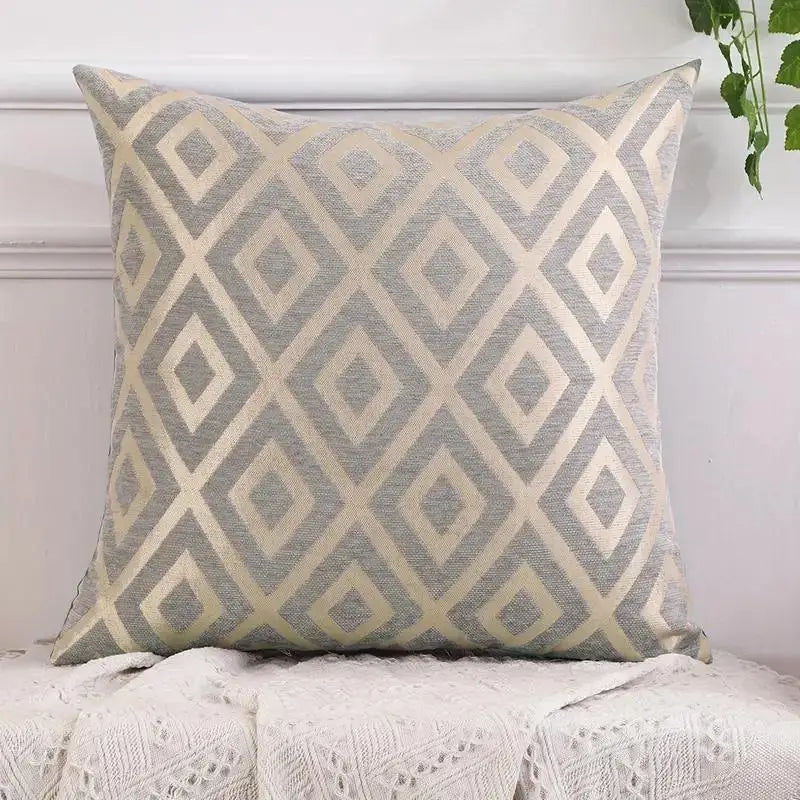 A square throw pillowcase featuring a diamond pattern in beige and gray tones.