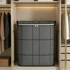 A gray foldable storage bag for clothes and bedding is displayed on a shelf inside a wooden cabinet.