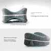 Gray memory foam knee pillow with a supportive strap design and a slope downward shape