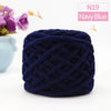 Navy blue chunky velvet knitting yarn in a tightly twisted ball for home decor