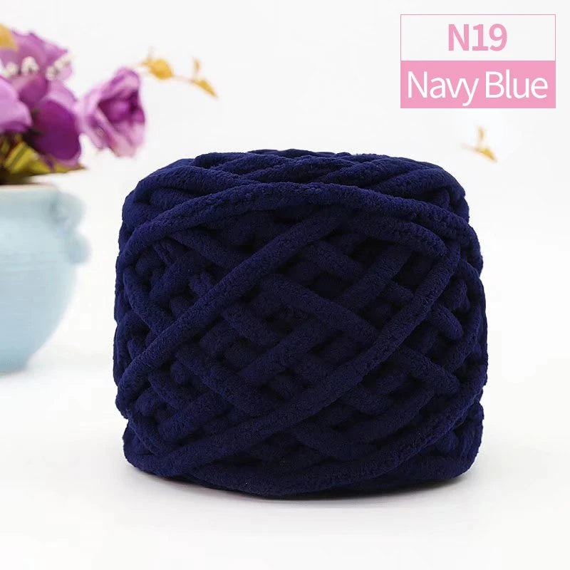 Navy blue chunky velvet knitting yarn in a tightly twisted ball for home decor