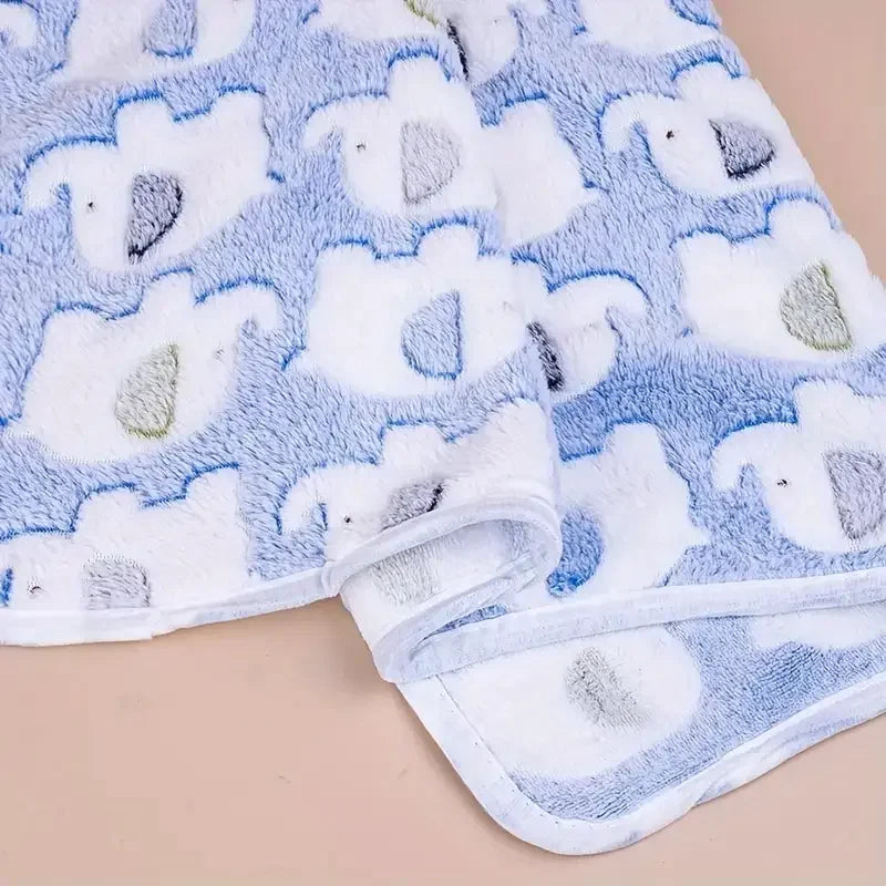 A light blue and white flannel pet blanket featuring a repeating elephant pattern for dogs and cats.