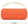 A skein of thick orange polyester blended yarn coiled for crafting.